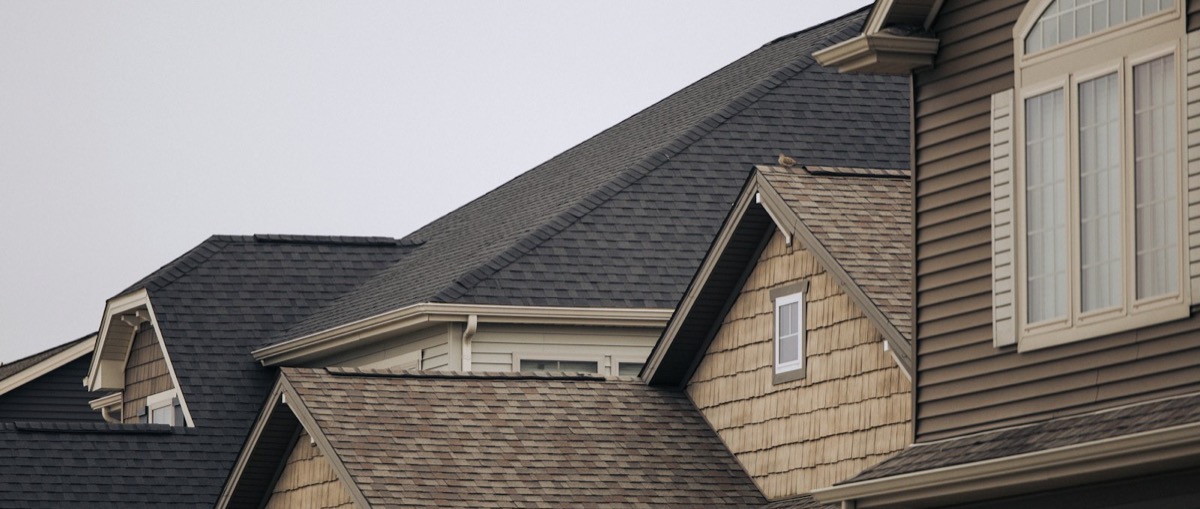 A house with clean, well-maintained roof shingles and gutters — Portland Roof & Gutter Co., Portland OR & Vancouver WA